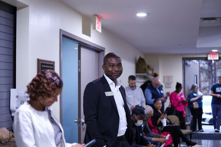 Image of elected officials standing during a meeting
