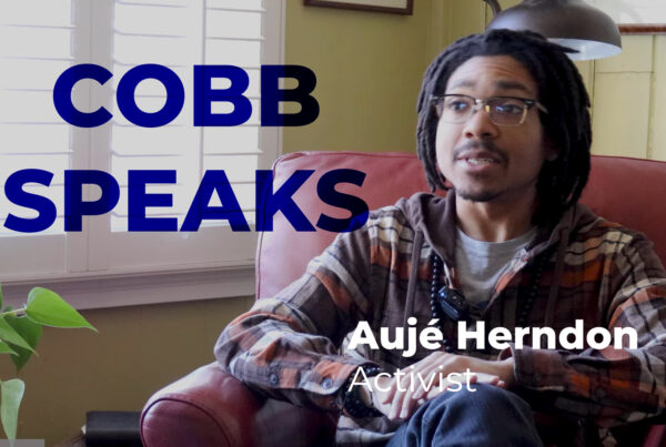 A screenshot of a youtube video featuring a young man in a flannel shirt