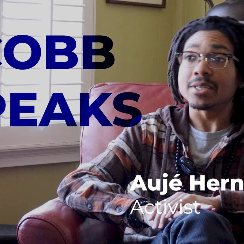 A screenshot of a youtube video featuring a young man in a flannel shirt