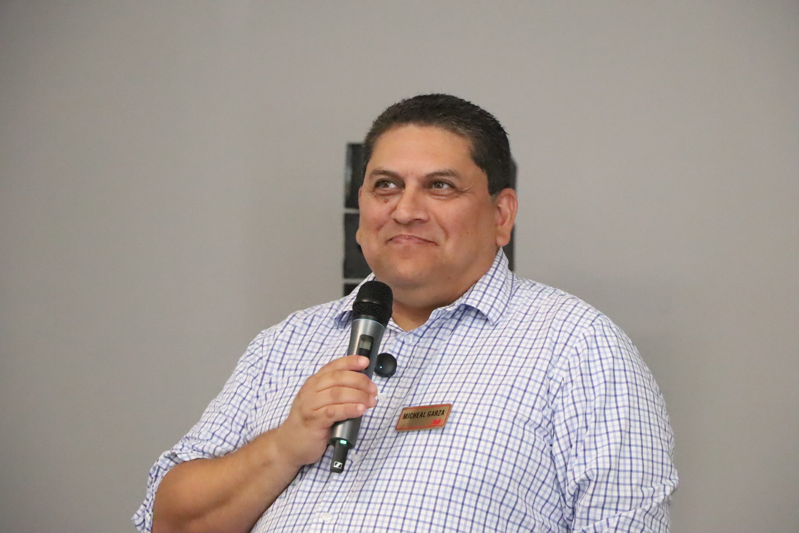 A man speaking into a microphone.